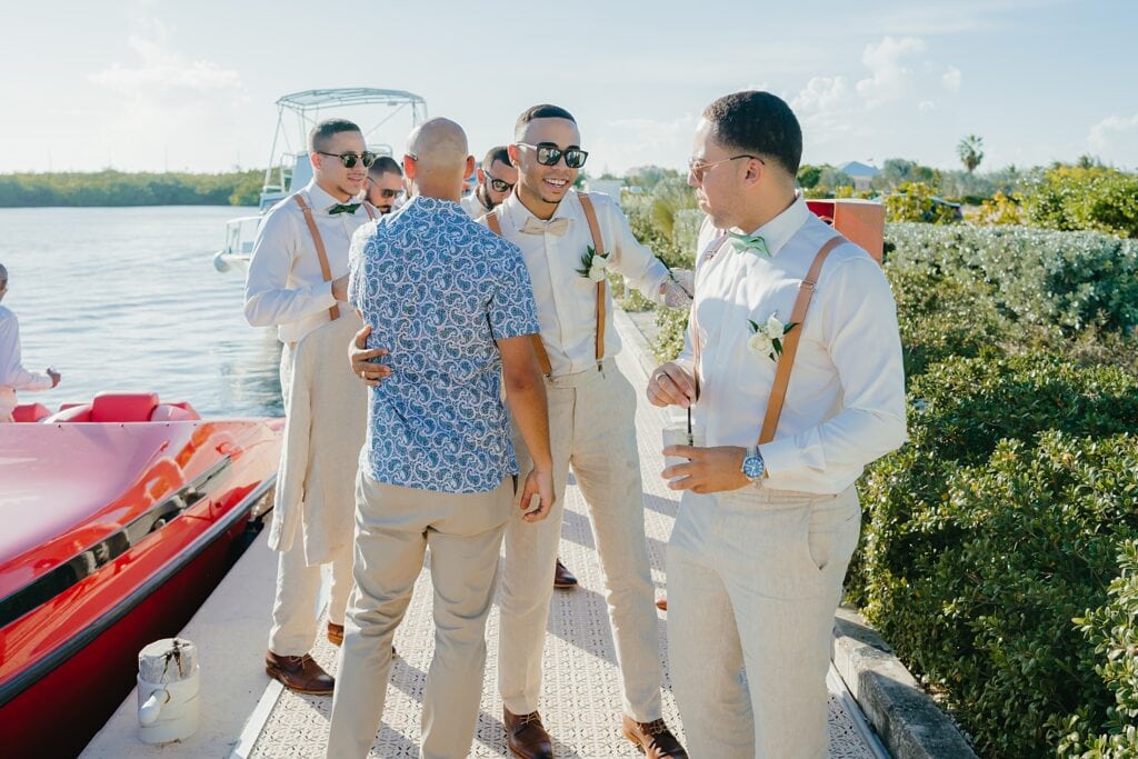 grand cayman wedding photographer morgans groom arrival boat