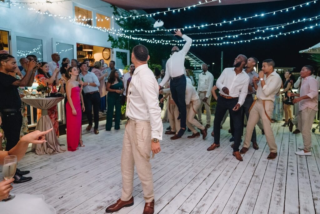 grand cayman wedding photographer reception morgans garter toss