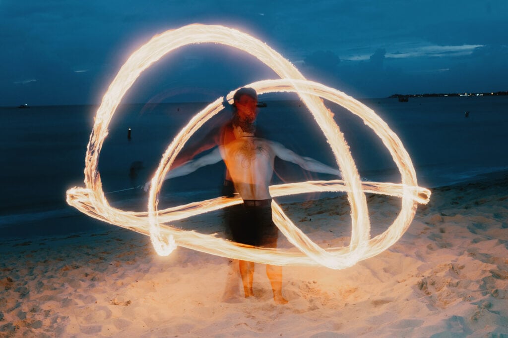 grand cayman beach portrait photography fire spin dance