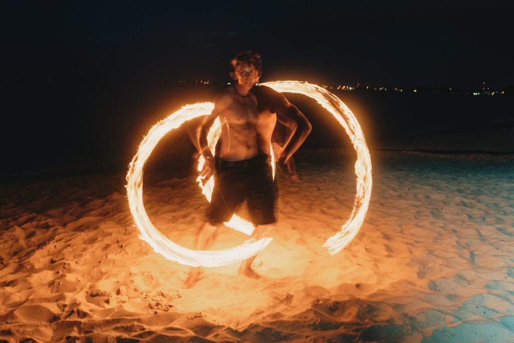 grand cayman beach portrait photography fire spin dance long exposure