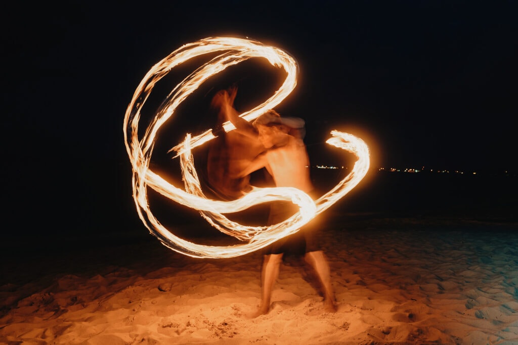 grand cayman beach portrait photography fire spin dance long exposure