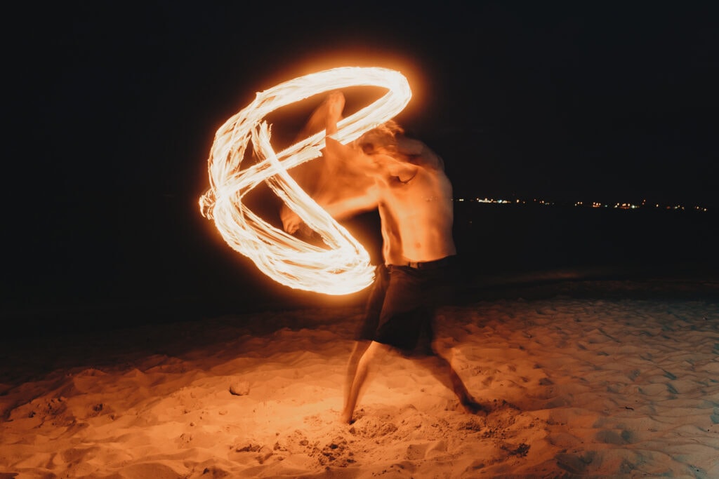 grand cayman beach portrait photography fire spin dance long exposure