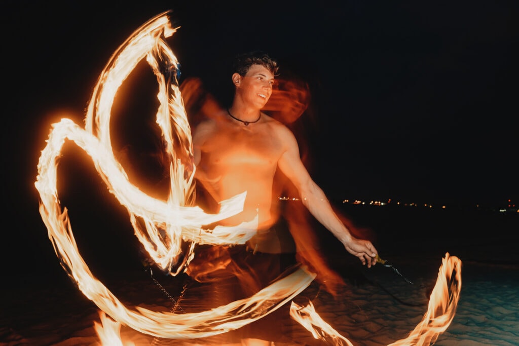 grand cayman beach portrait photography fire spin dance long exposure