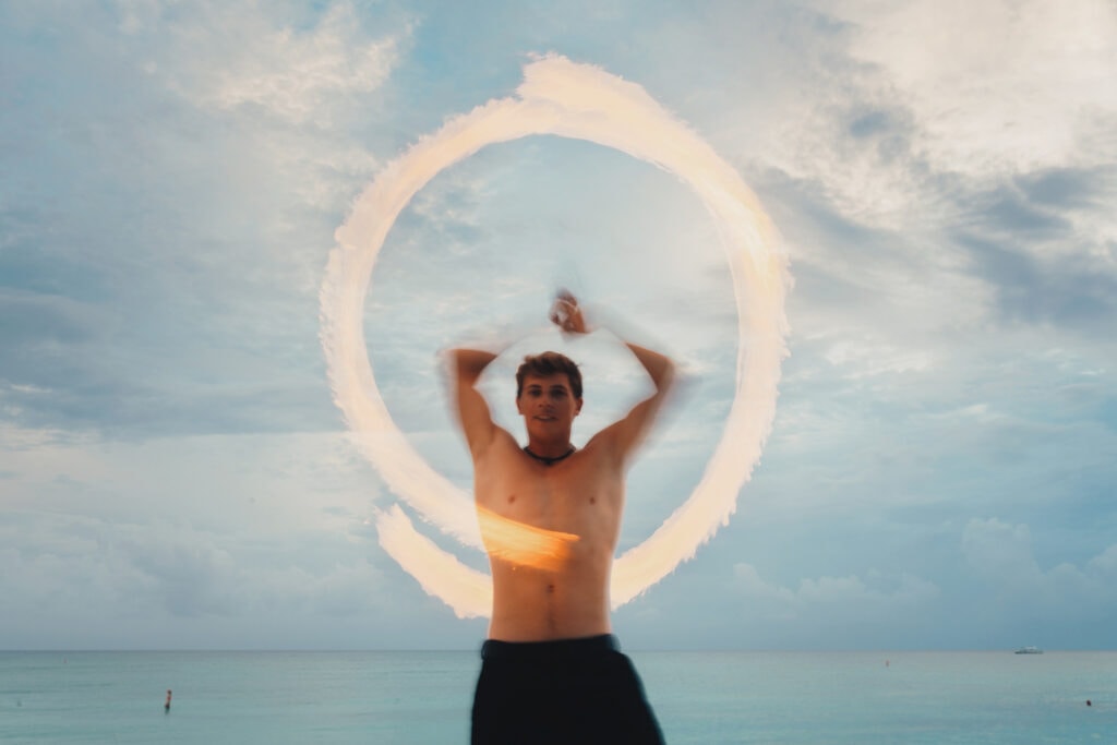 grand cayman beach portrait photography fire spin dance