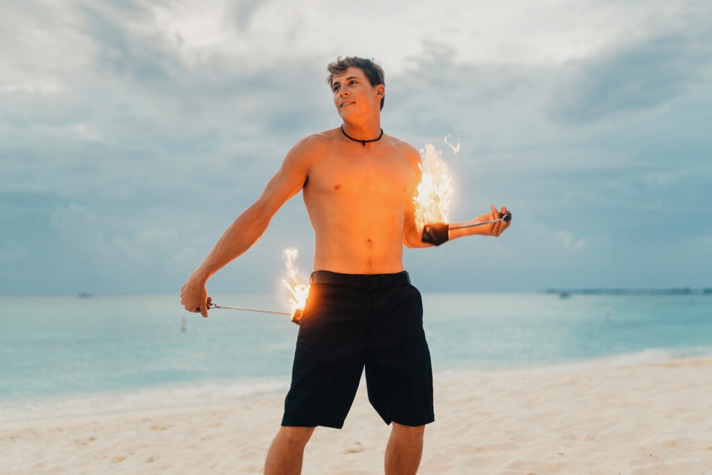 grand cayman beach portrait photography fire spin dance