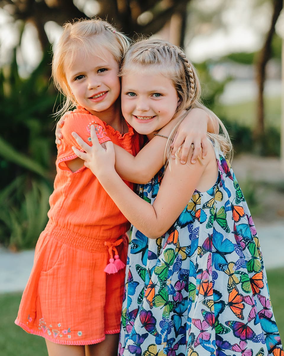 grand cayman islands family photography seven mile beach sisters