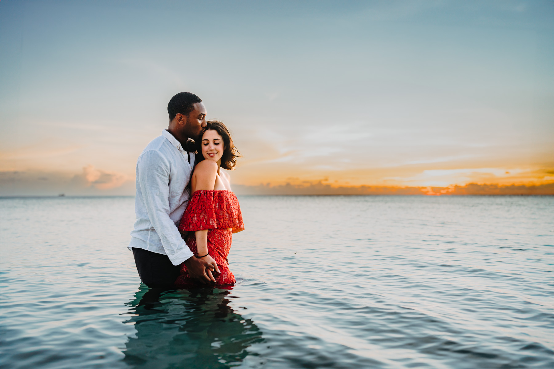 auckland couple engagement photographer beach sunset