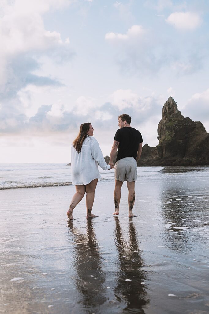 Surprise proposal piha beach auckland engagement photographer
