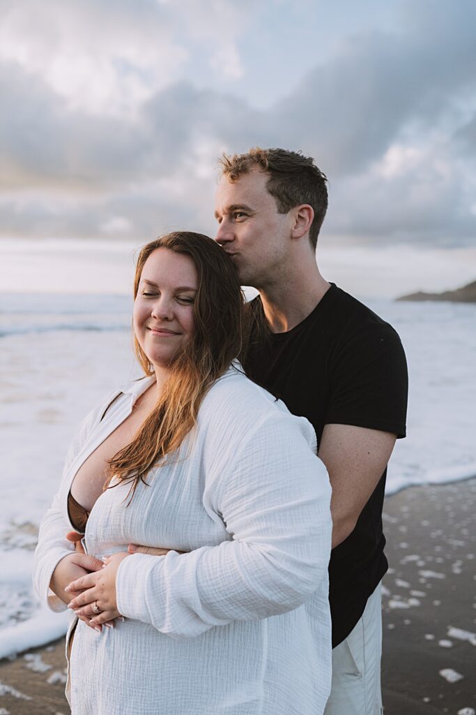 Surprise proposal piha beach auckland engagement photographer