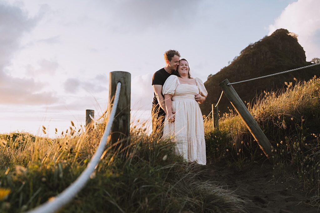 Surprise proposal piha beach auckland engagement photographer