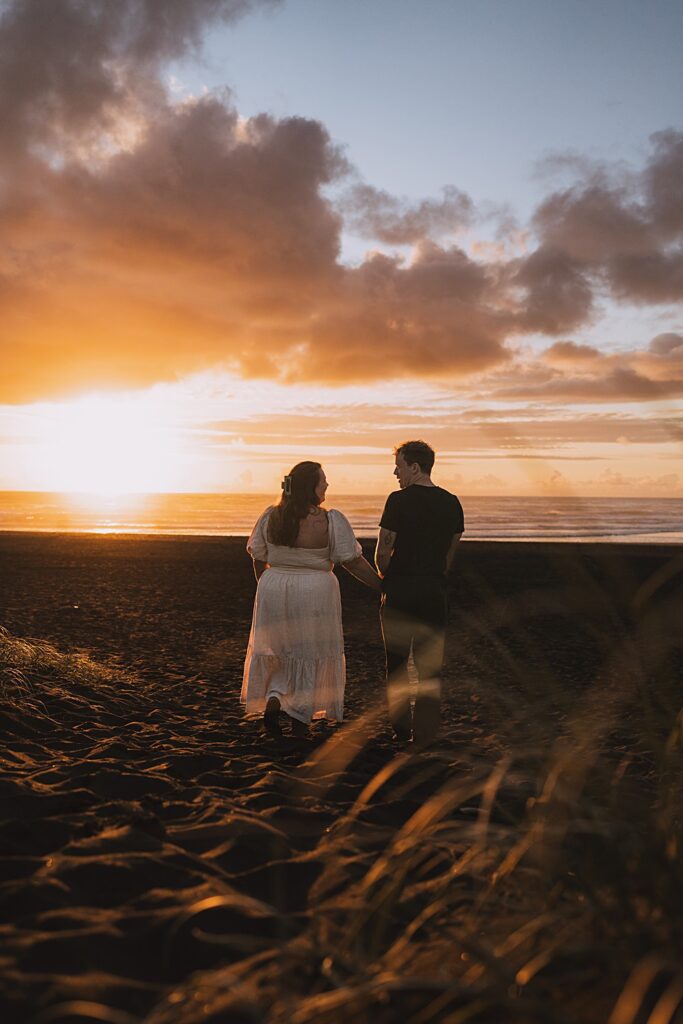 Surprise proposal piha beach auckland engagement photographer