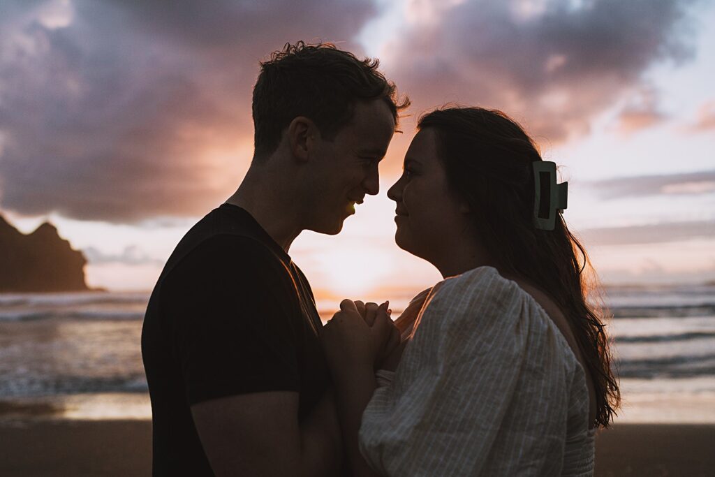 Surprise proposal piha beach auckland engagement photographer
