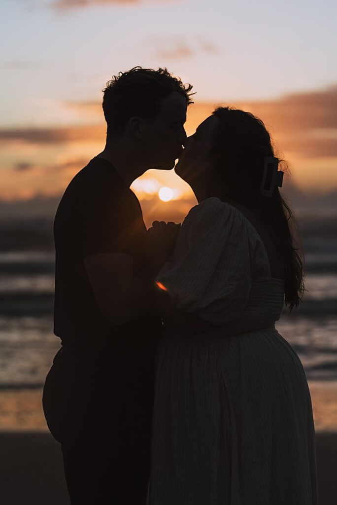 Surprise proposal piha beach auckland engagement photographer